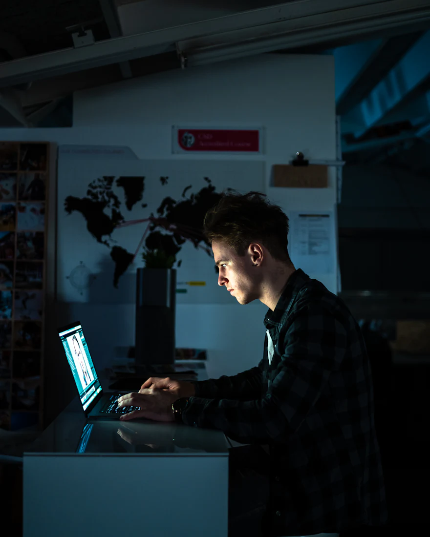 A man working with focus on his laptop